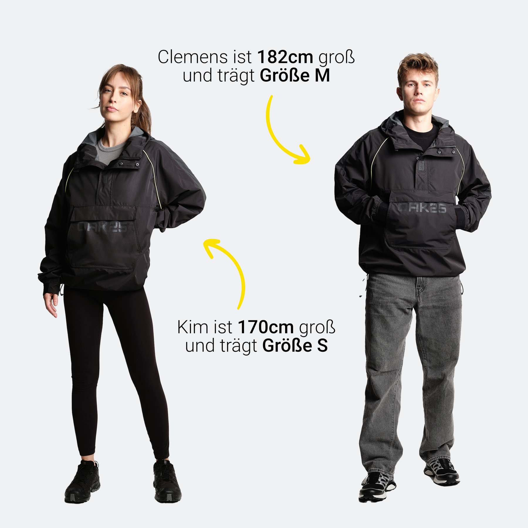 Zwei Modelle tragen schwarzen OAK25 Commute Windbreaker, Clemens (182 cm) in Größe M, Kim (170 cm) in Größe S