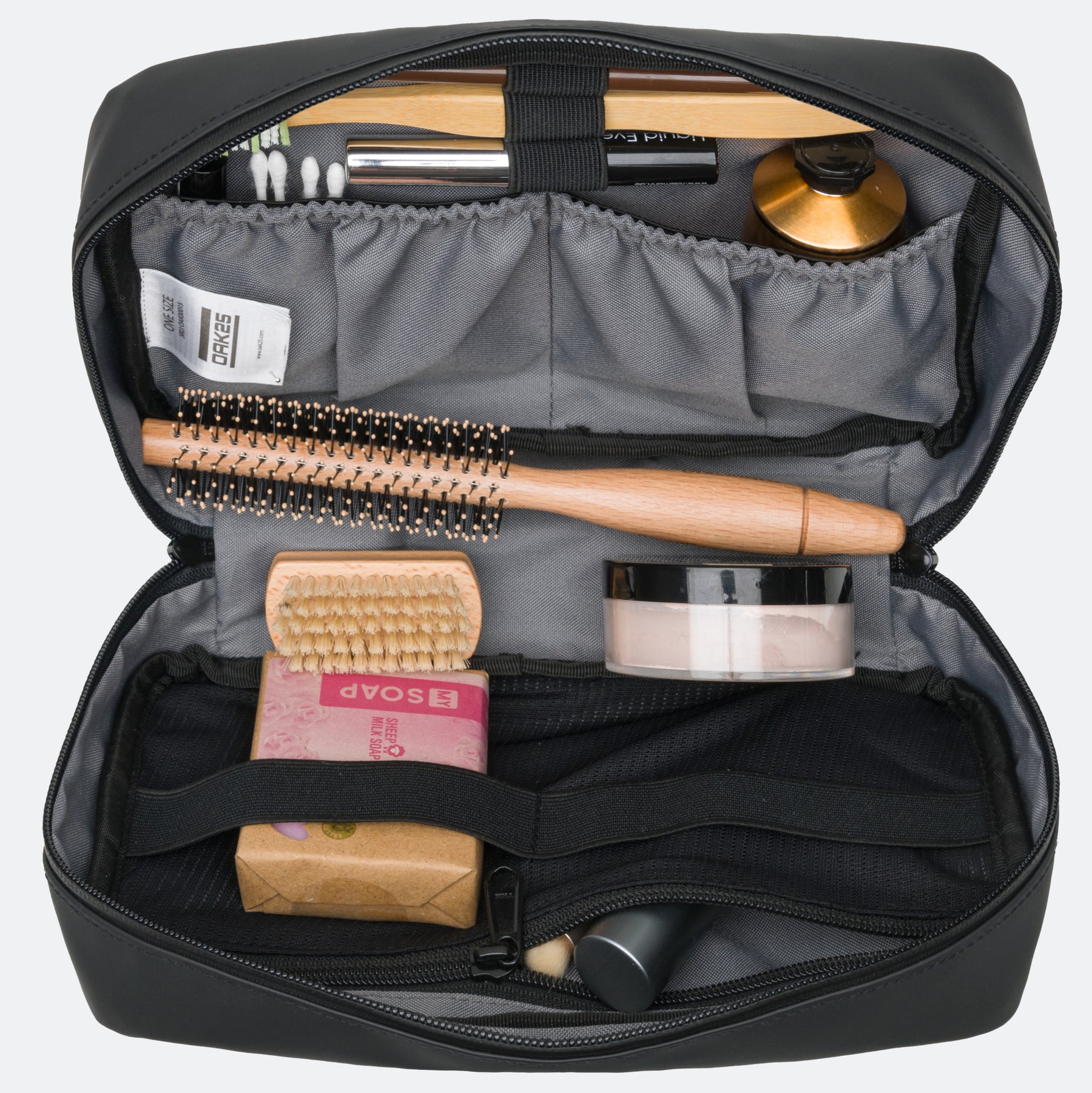 Schwarze wasserabweisende Kulturtasche mit Bürste, Seife, Puder, Wattestäbchen und Kosmetik
