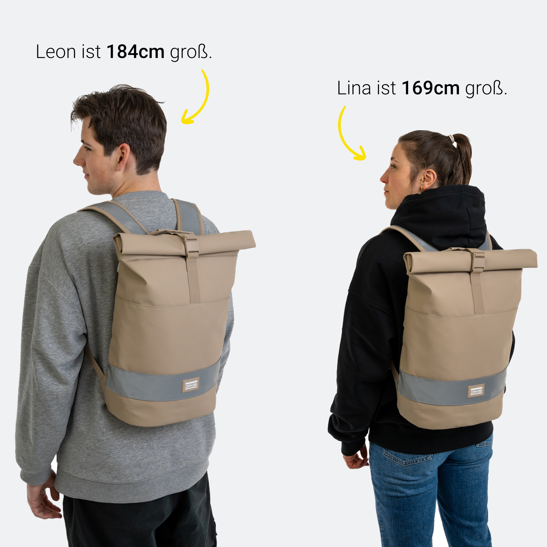 Junge trägt sandfarbenen rolltop Rucksack mit reflektierendem Streifen, Größe bei 184 cm