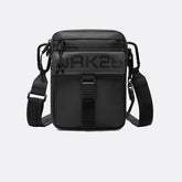 Schwarze Bauchtasche mit verstellbarem Gurt, Reflektoren und 'OAK25' Aufschrift