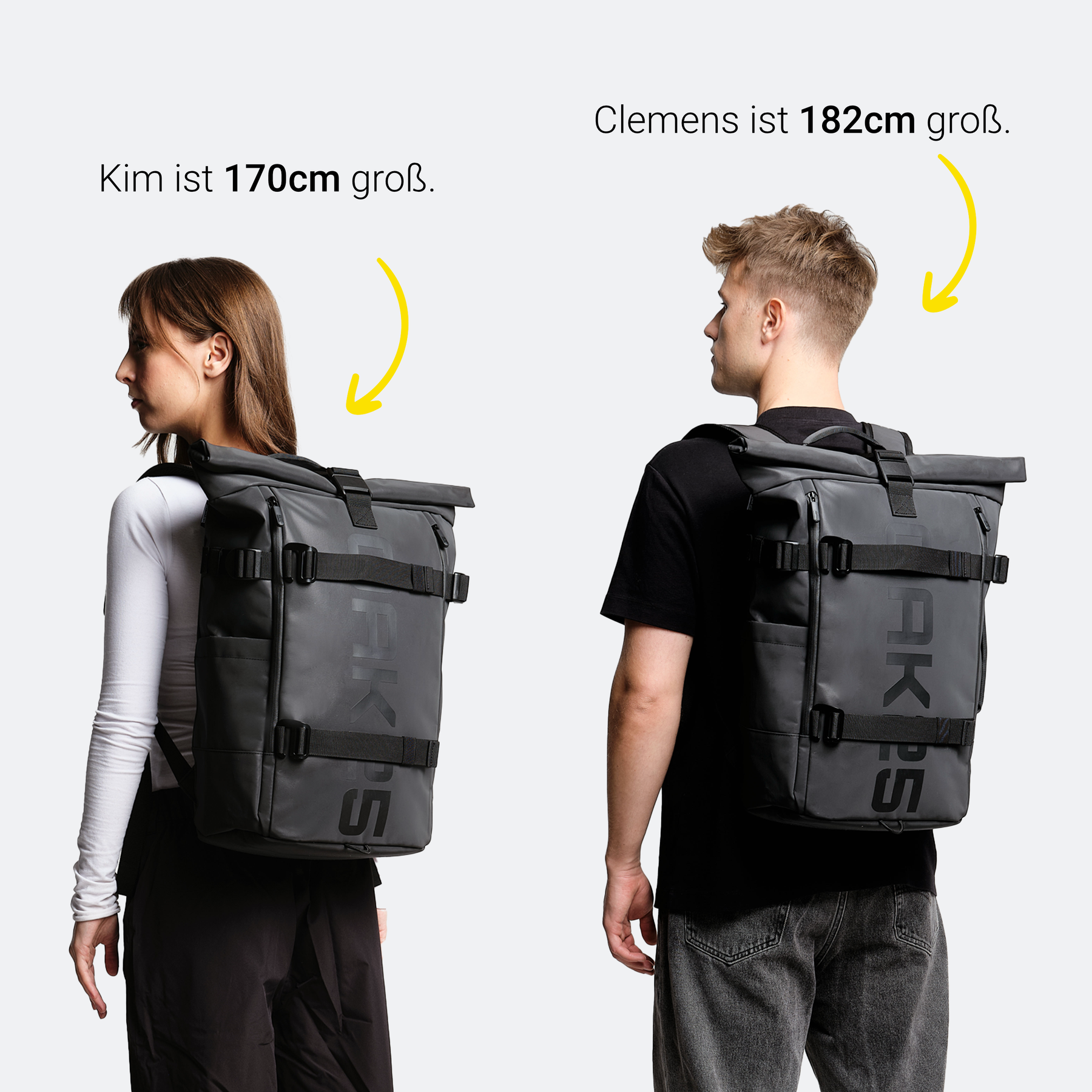 Zwei Personen mit schwarzen rollbaren Luminite-Rucksäcken von OAKPS, Kim ist 170 cm groß, Clemens 182 cm groß